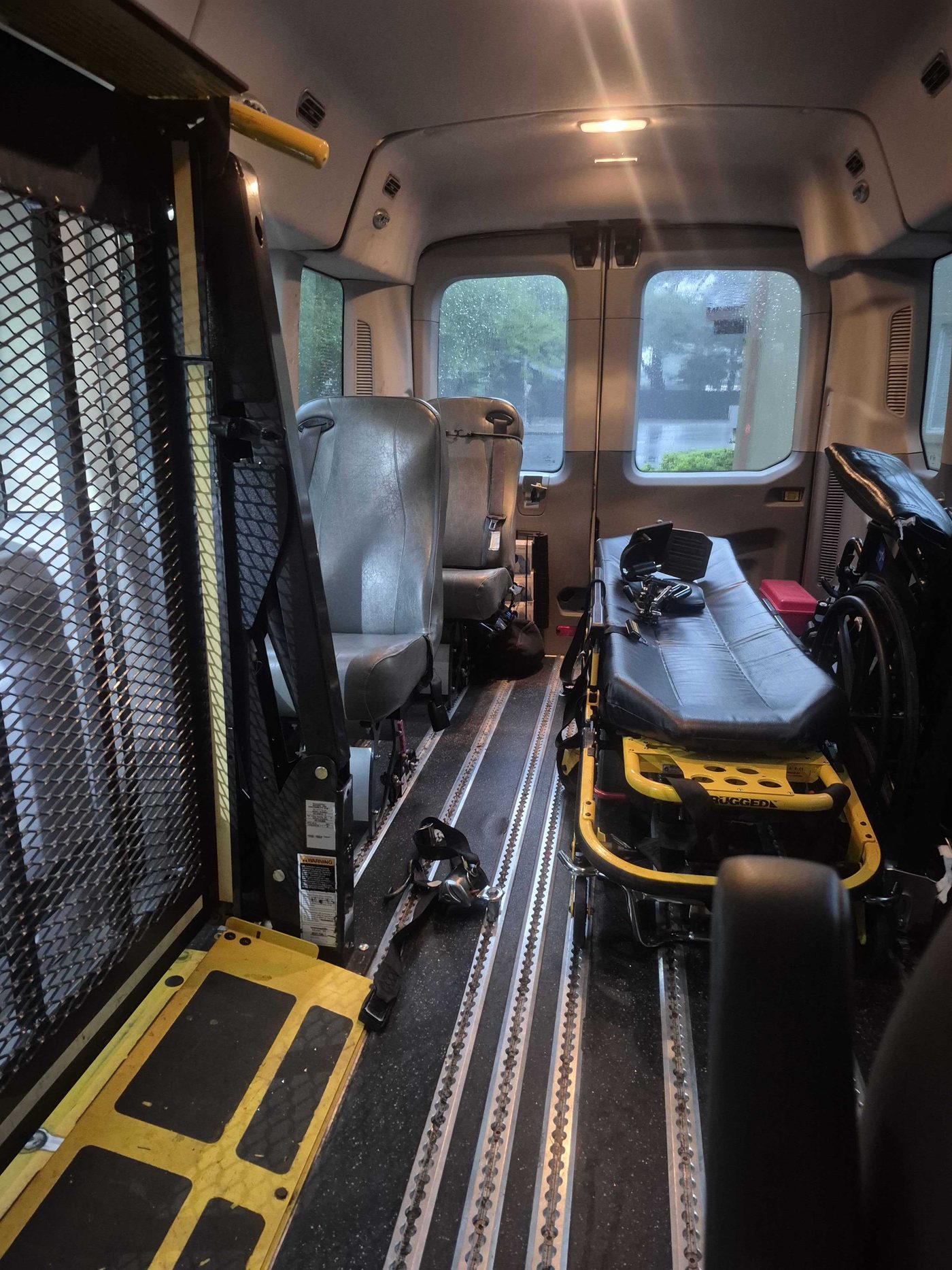 Gurney secured inside a Gold Mountain Transport van